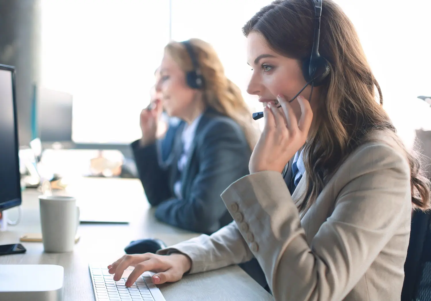 A U.S.-based HDM billing expert on a call in a modern office